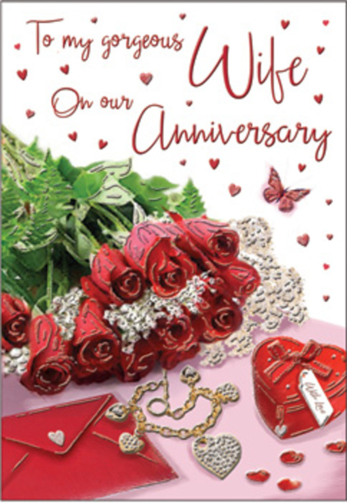 A richly romantic anniversary scene unfolds as if arranged on a wooden table in a stylish Hackney Wick apartment, where creativity and affection meet. At the heart of the composition is a bouquet of classic red roses, each bloom opening generously, petals layered in deep, velvety spirals that convey both passion and comfort. The roses are nestled among fresh green foliage, their leaves adding brightness and a sense of natural abundance, recalling the greenery along the nearby Hertford Union Canal. Surrounding the flowers are small, meaningful objects that suggest years of shared gifts and tender gestures: a polished jewellery set that glows softly in the light, a vibrant red gift box with a subtle sheen, and an envelope that seems poised to reveal handwritten anniversary words. Scattered heart motifs, both printed and three-dimensional, weave through the composition like a gentle pattern of devotion. The textures in the scene-smooth card stock, satin-like ribbon, metallic jewellery, and the soft, plush look of rose petals-interplay beautifully under the warm, diffused lighting. Hints of lace and delicate decorative trims contribute a touch of vintage charm, much like the characterful corners of Hackney Wick's artist studios and galleries. The overall mood is one of intimacy and reflection, as though the recipient is invited to pause, breathe in the imagined fragrance of the roses, and remember all the anniversaries that led to this moment. The card's script, though only partially legible, adds a lyrical element that ties together the visuals into a heartfelt celebration of long-lasting love.